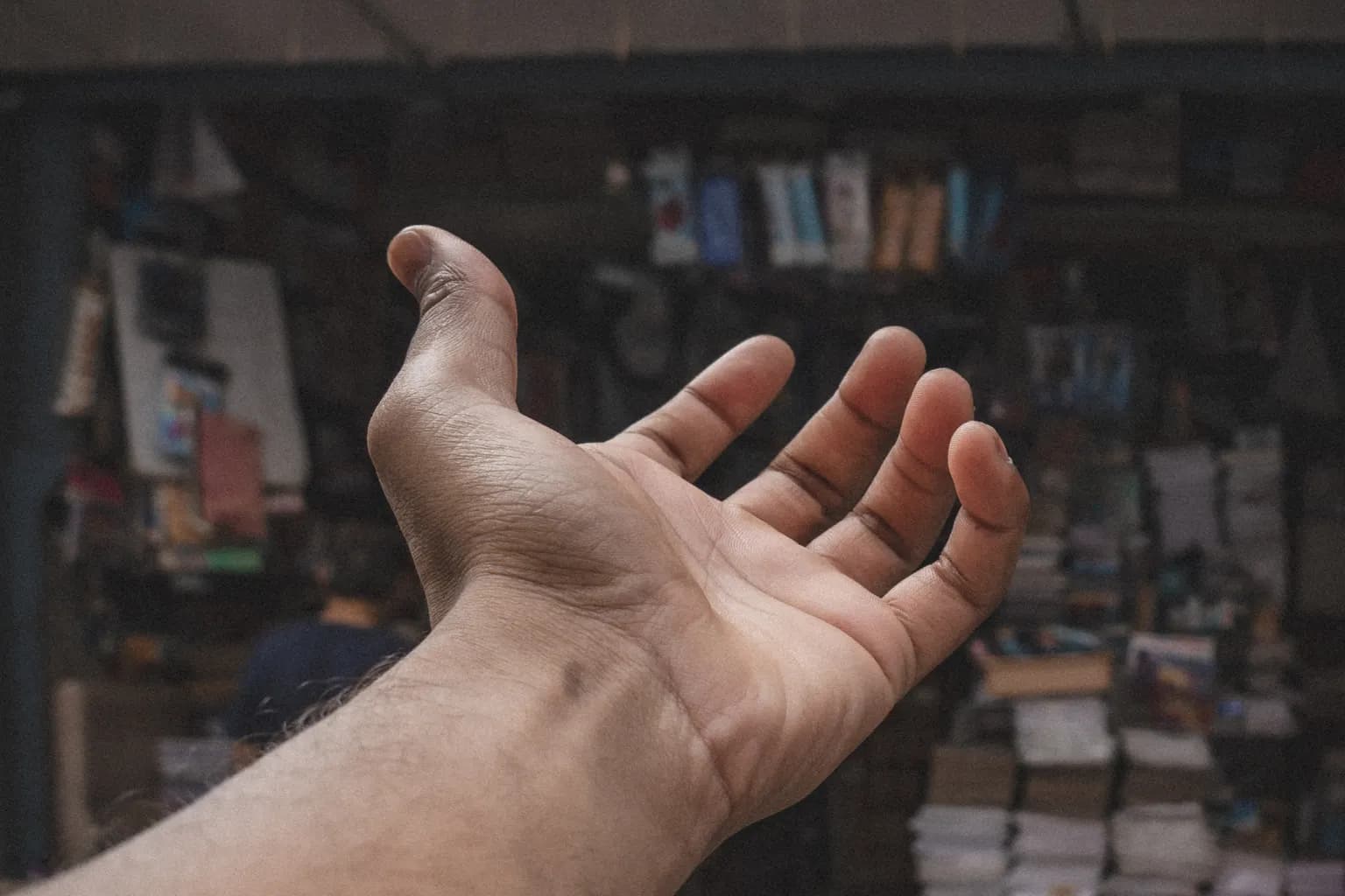 A hand indicating a neighbourhood shop in Ahmedabad