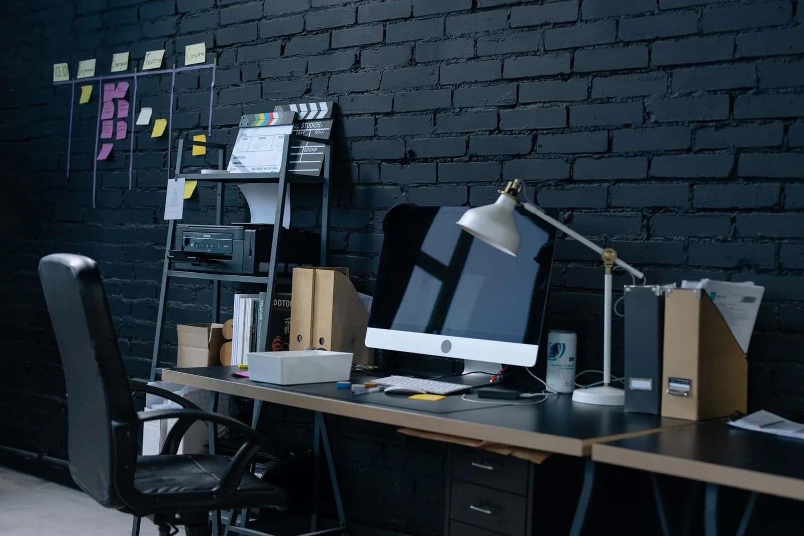 Engineering workspace with build notes and monitors